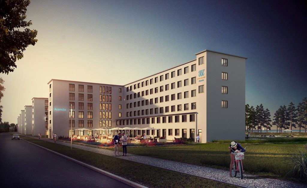 Architekturvisualisierung mehrerer moderner Gebäude mit begrünten Außenflächen im Abendlicht.